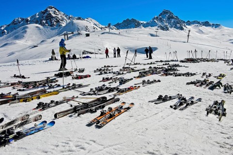 Pairs of skis lying on snow, Les Contamines-Montjoie ski resort