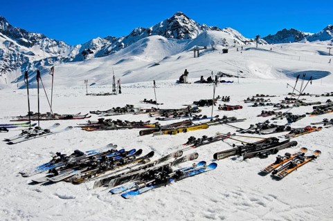 Pairs of skis lying on snow, Les Contamines-Montjoie ski resort