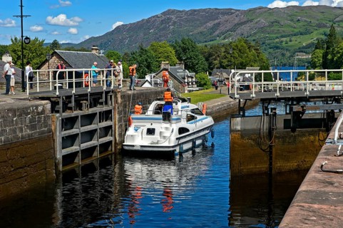 Motorboat passing through lock in Caledonian Canal
