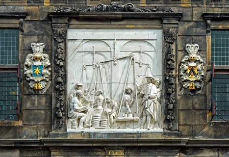 Waaghaus relief depicting weighing of cheese in ancient times