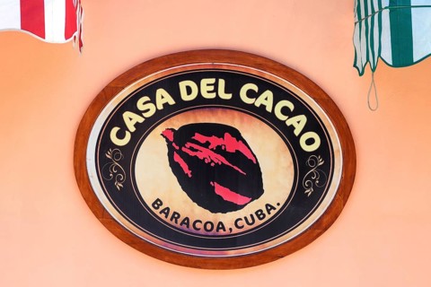 Shop sign on a house wall