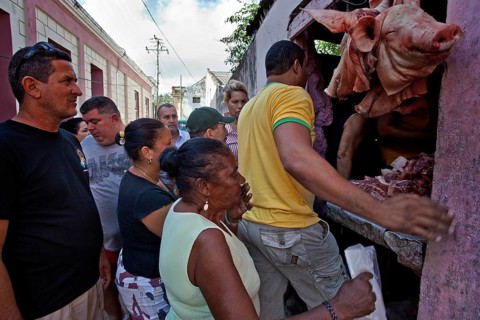Locals at a sales stand with meat
