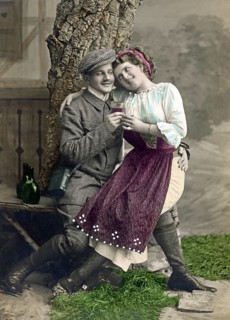 Lovers flirting and drinking wine