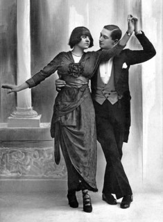 Couple dances with serious gaze