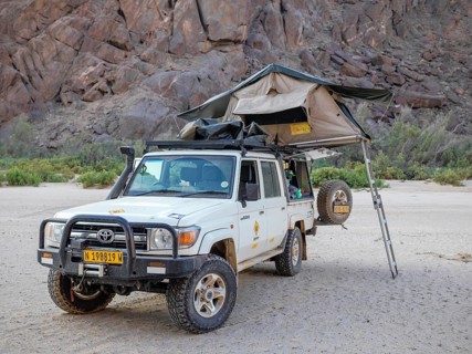 4x4 vehicle with raised roof tent