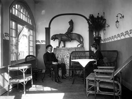 Couple sits in winter garden and converses