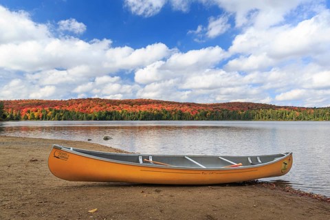 Canoeing on the shores of Canisbay Lake in Autumn