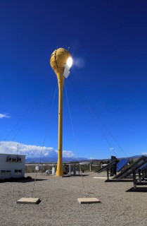 Heliostats reflecting sunrays to receiver tower