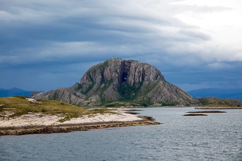 Torghatten granite mountain with a hole through it