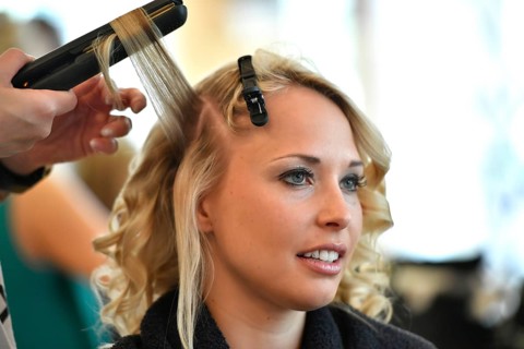 Young woman being styled at the hair salon