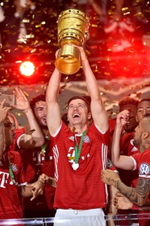 Robert Lewandowski lifting the DFB Cup in the air