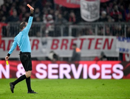 Referee Marco Fritz shows yellow-red card