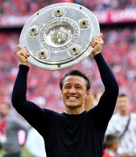 Coach Coach Niko Kovac FC Bayern Munich FCB cheers with championship cup