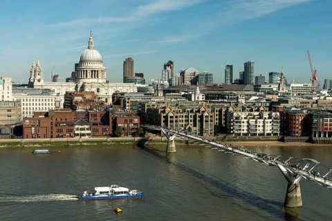 London skyline with St Paul's Cathedral and Millennium Bridge over the River Thames