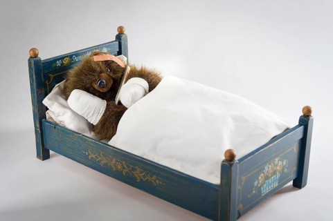 Sick Teddy Bear with head and paws bandaged