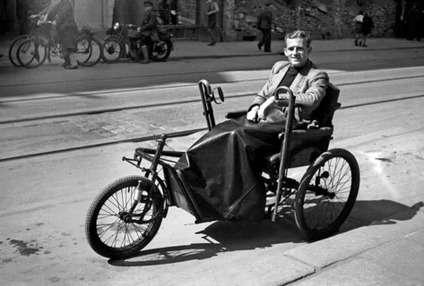 Photographer Karl Heinz Mai in a wheelchair