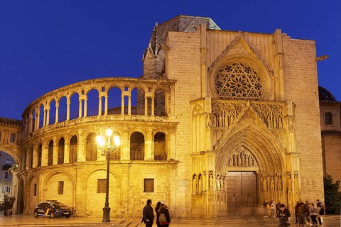 Illuminated gothic apostle portal of the cathedral of Valencia