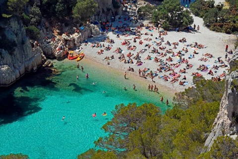 Tourists at beach with turquoise water
