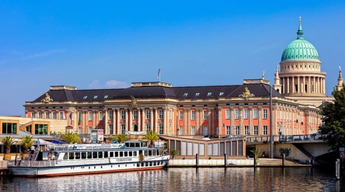 excursion boat in front of Parliament Potsdam and St. Nicholas Church