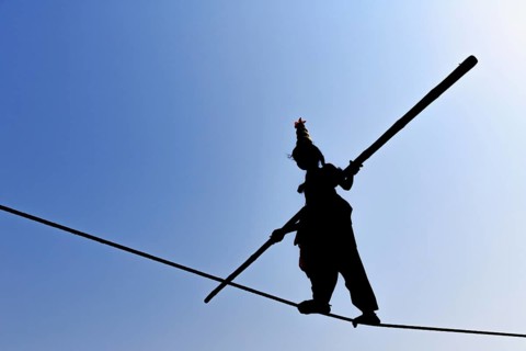 Young girl balancing on rope