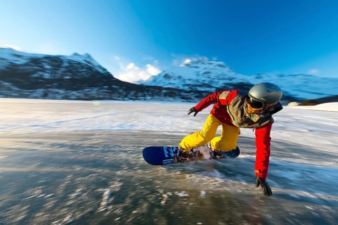 Snowboarder on frozen lake