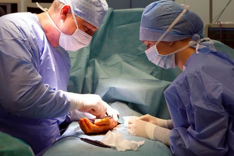 Surgeons during surgery in the operating theatre