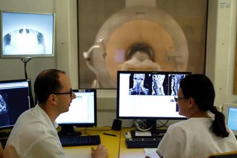 Doctors at RDG Radiology screen examination
