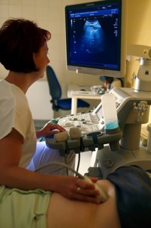 Nurse at the monitor with patient at ultrasound