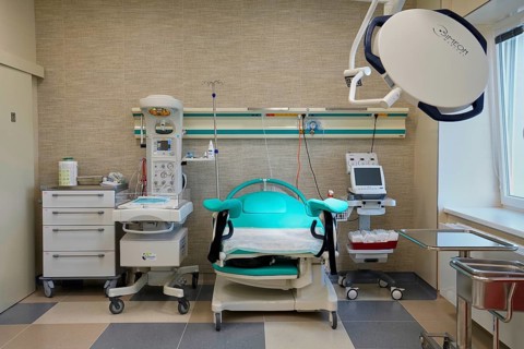 Empty modern delivery room with birthing chair