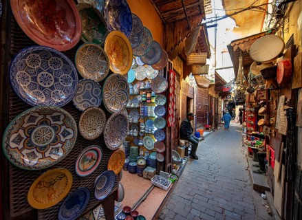 Colourfully painted plates and tiles