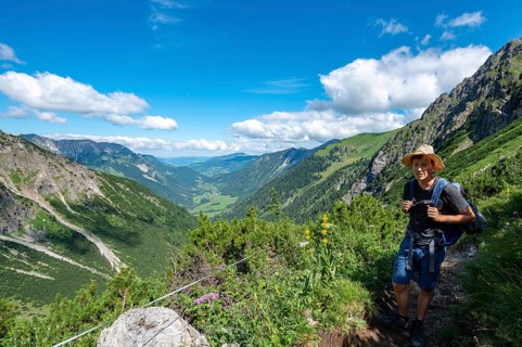Hiker on the hiking trail from Hinterstein to Schrecksee