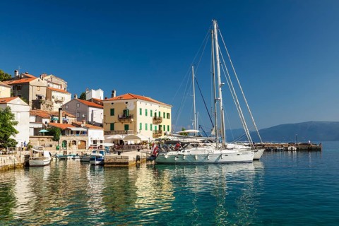 Small fishing village with sailing boats
