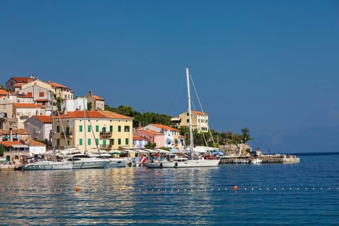 Small fishing village with sailing boats