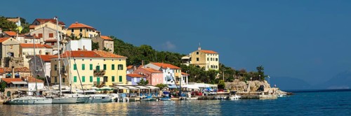 Small fishing village with sailing boats