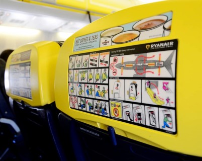 Safety display and advertisement on airplane seat backrest