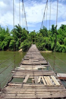 Dilapidated suspension bridge over River Kwai