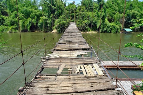 Dilapidated suspension bridge over River Kwai