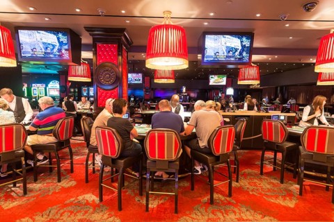 Poker players at poker table in casino
