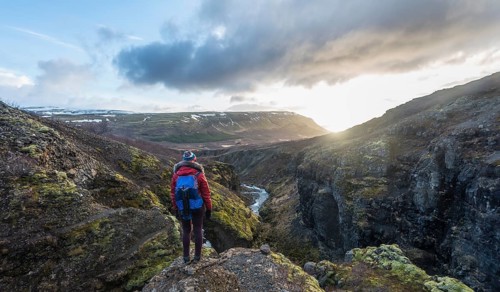 Hiker looking towards Canyon of Glymur