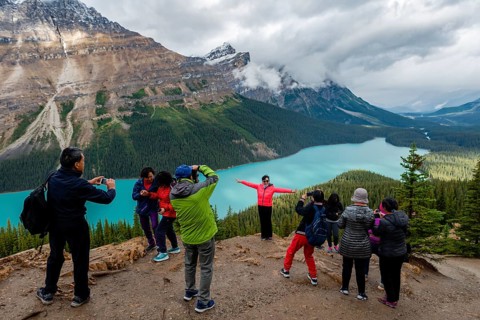 Asian tourists pose for a photo