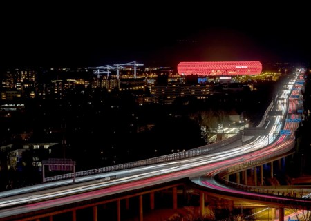 Red lit Allianz Arena at A9 motorway