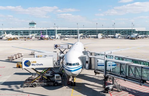 Passenger aircraft with docked passenger boarding bridge