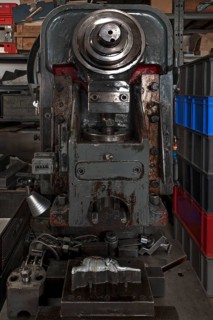 squeezing machine from the 1950s with mold and ready pressed elephants