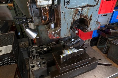 Squeezing machine from the 1950s with mold and ready pressed elephants