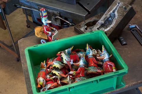 assembly box with tin toys of the 1950s