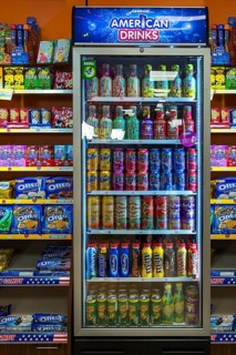 Beverage cans in a refrigerator in a grocery store