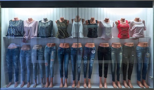 Shop window with busts of fashionable T-shirts