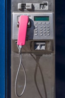 Public pay phone with pink handset