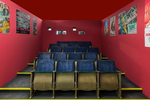 Reproduced cinema hall with seats from the 1970s