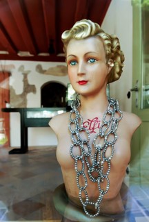 Old mannequin of the 20s with necklace